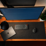 Small Home Office Ideas: What Actually Works Image of a fairly modest looking desk setup with a few accessories from above.