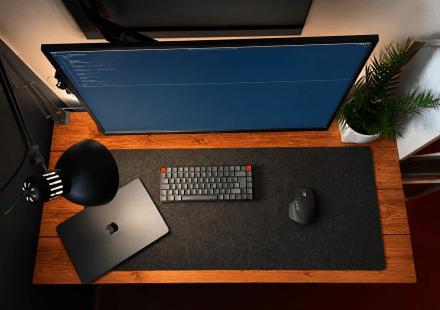 Image of a fairly modest looking desk setup with a few accessories from above.